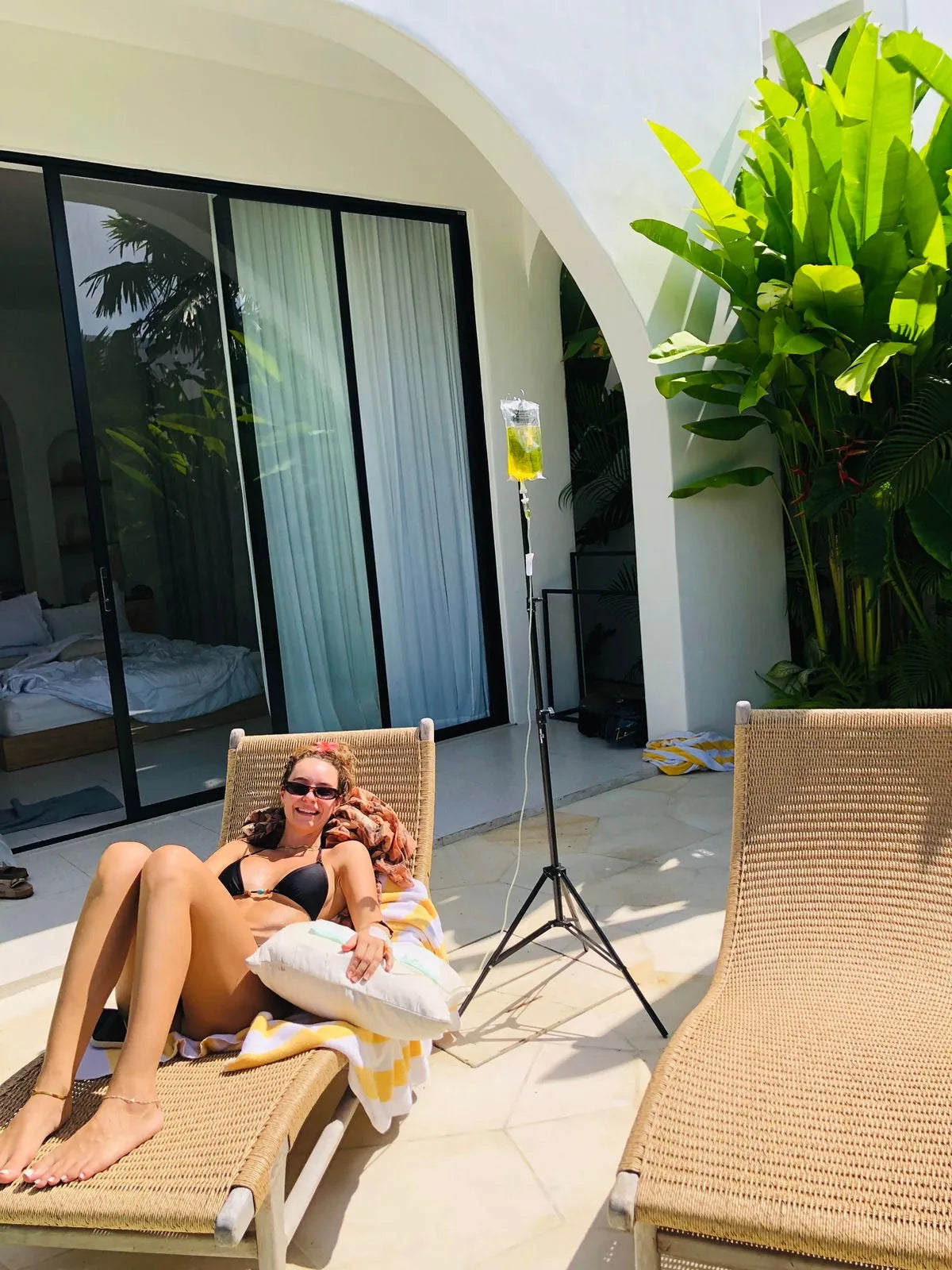 Patient relaxing during a mobile IV treatment in Bali